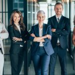 Portrait of Mixed age range and multi ethnic business team looking at camera in the office